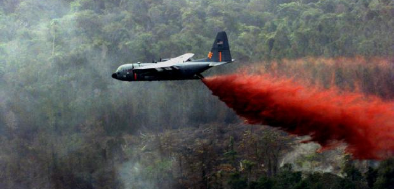 Airplane releasing Agent Orange herbicide chemicals